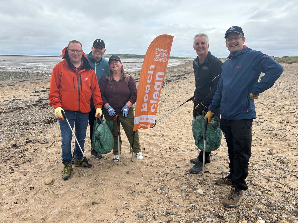 Macfarlane team at beach clean up July 2024.jpg