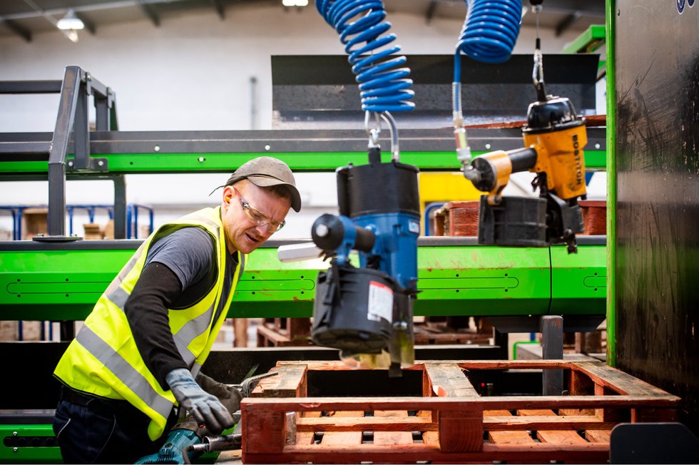 IPP pallets being repaired.jpg